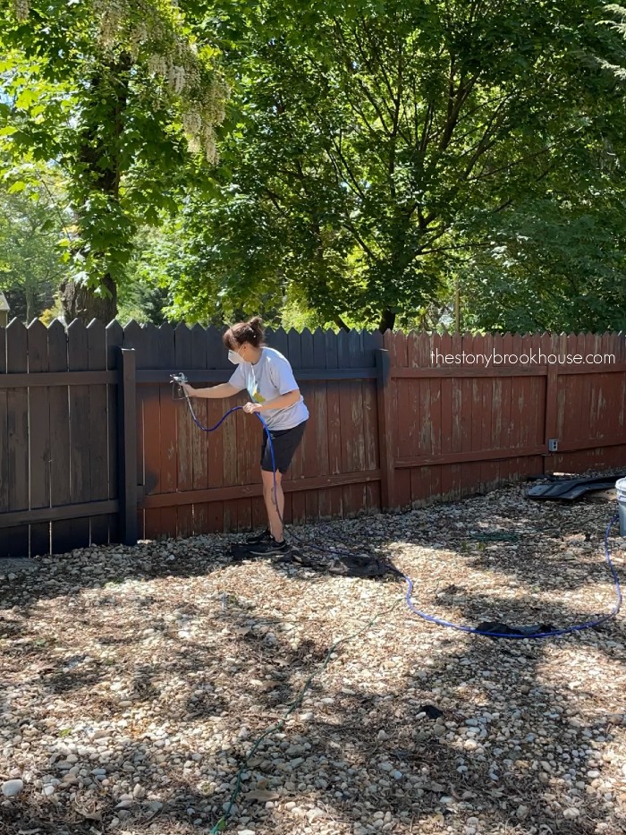 Spray painting the fence