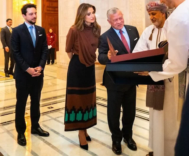 Queen Rania wore a floral-embroidered polka-dot midi dress by Giambattista Valli. Johanna Ortiz Lucid top and midi skirt