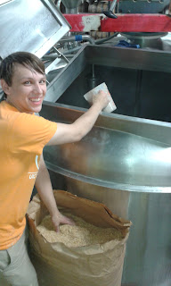 Richard adding rice hulls to the Mash Tun