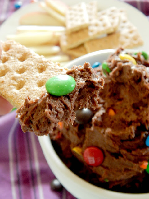 M&M Cake Batter Dip...this dip of your dreams!  Creamy, rich chocolate studded with M&M's.  Dip with sliced fruit or graham crackers and it will be the party hit! (sweetandsavoryfood.com)