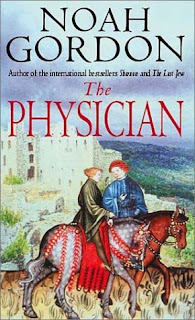 The Physician book cover (a medieval-style painting of two people riding on horseback, with a stone building in the background)