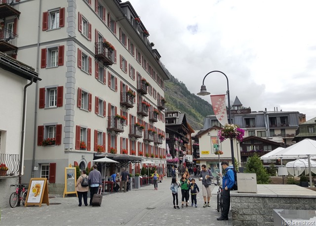 The stretch of Bahnhofstrasse, near Hotel Monte Rosa (white building with red window shutters), where the bronze markers of the Walk of Climb could be found. 