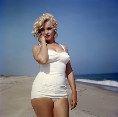 Marilyn Monroe in bathing suit on beach with curves