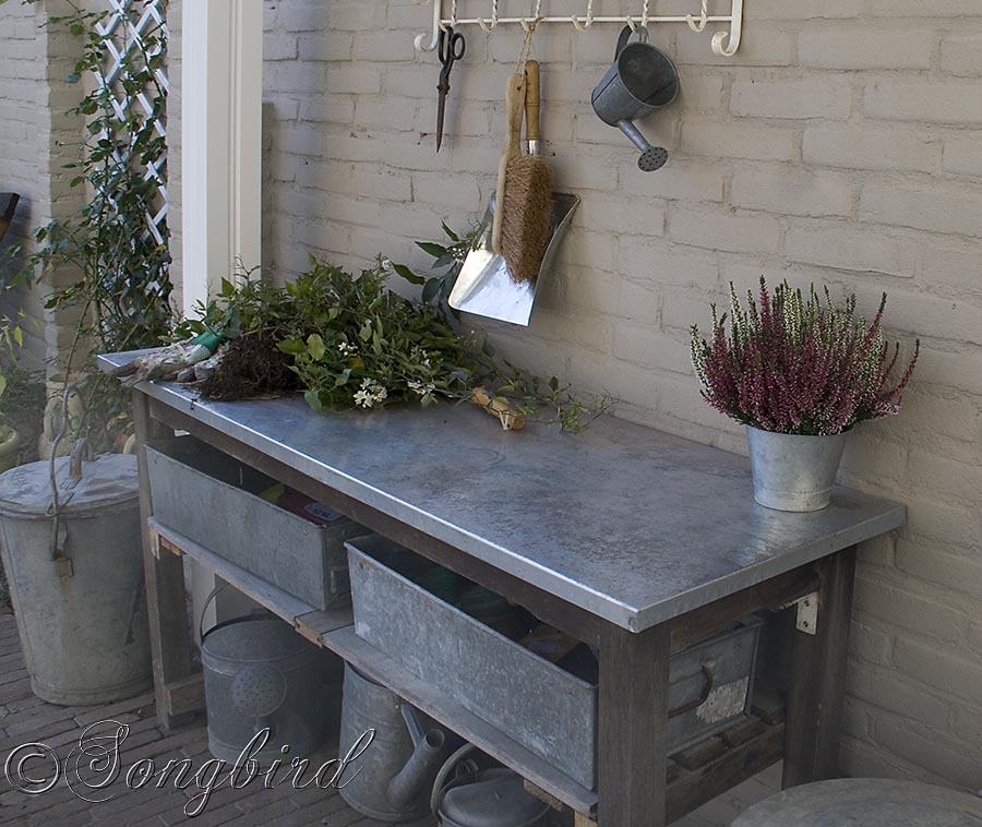 Vintage Coat Rack Finishes A Garden Work Area With A Work Bench With Galvanized Top