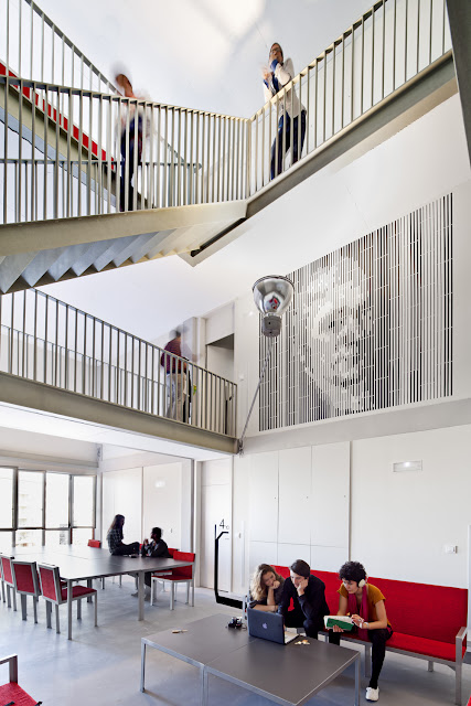 Photo of the lobby and the staircase with some furniture for students