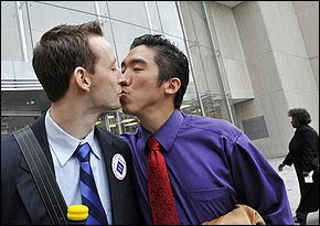 Two men kissing