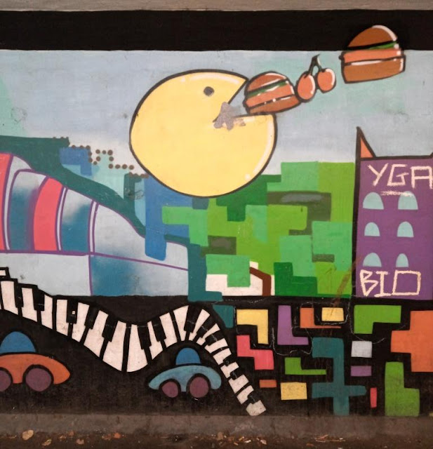 Pac-Man street art by Gorse Hill Studios in Stretford