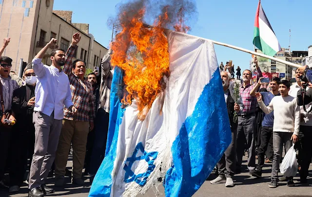 Cover Image Attribute: Demonstrators burn an Israeli flag during the funeral of seven Islamic Revolutionary Guard Corps members killed in a strike in Syria, which Iran blamed on Israel, in Tehran on April 5, 2024. /Source: ATTA KENARE / AFP