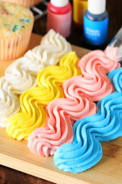 Bright colored homemade vanilla buttercream frosting recipe