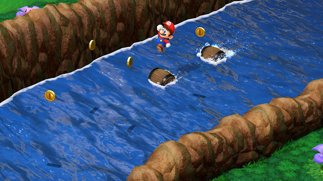 Imagem de Super Mario RPG que mostra Mario pulando em um barril em um rio.