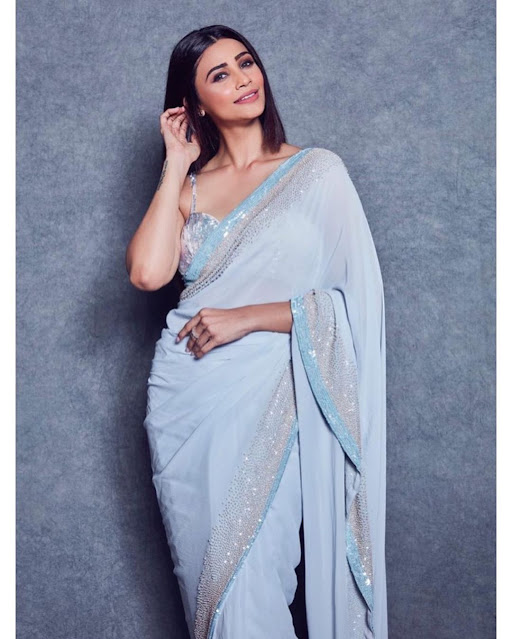 Bollywood actress Desi Shah flaunts her beauty in a sleeveless saree during the latest photoshoot, radiating elegance and style.