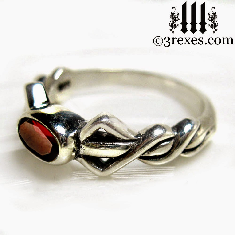  silver pixie ring with garnet stone