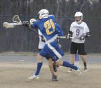 Senior David Houck attacks the Carrboro goal