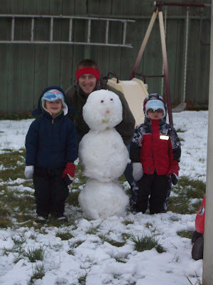 The boys and their first snowman of the season.