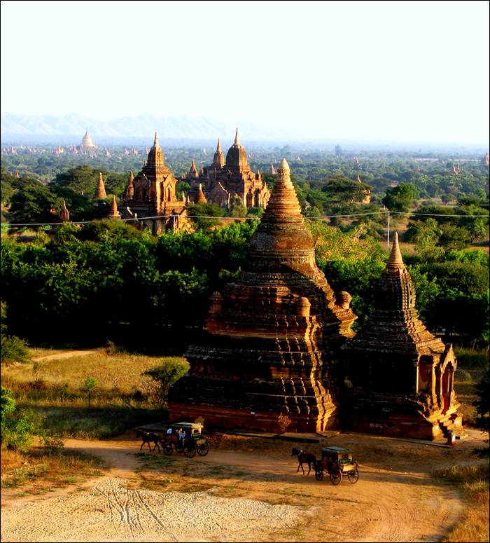 Bagan became a central powerbase in the mid 9th century under King Anawratha, who unified Burma under Theravada Buddhism. Over the course of 250 years, Bagan's rulers and their wealthy subjects constructed over 10,000 religious monuments in the Bagan plains. The prosperous city grew in size and grandeur, and became a cosmopolitan center for religious and secular studies. Monks and scholars from as far as India, Ceylon as well as the Khmer Empire came to Bagan to study prosody, phonology, grammar, astrology, alchemy, medicine, and law.