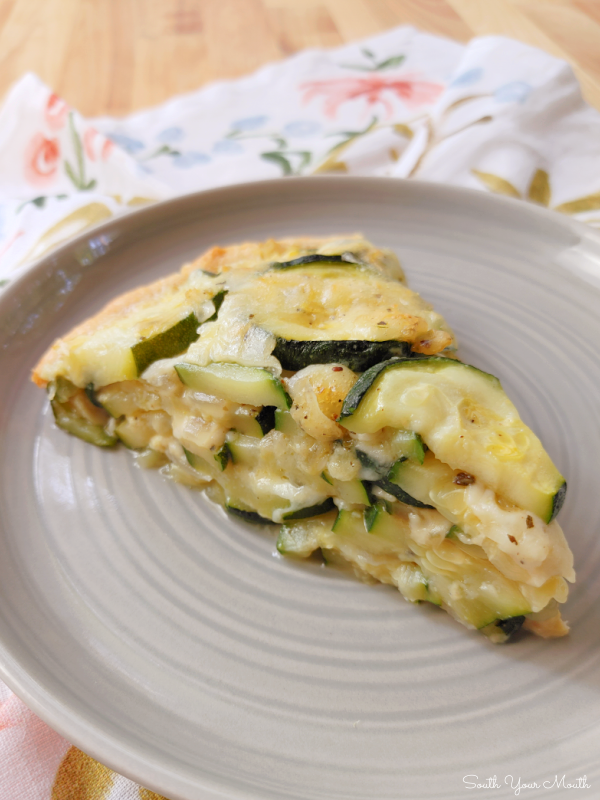 Zucchini Pie! A savory pie or tart recipe made with zucchini, mozzarella cheese and Italian herbs baked in a crescent roll crust.