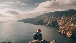 An expanse of water with rugged coastline on the right.