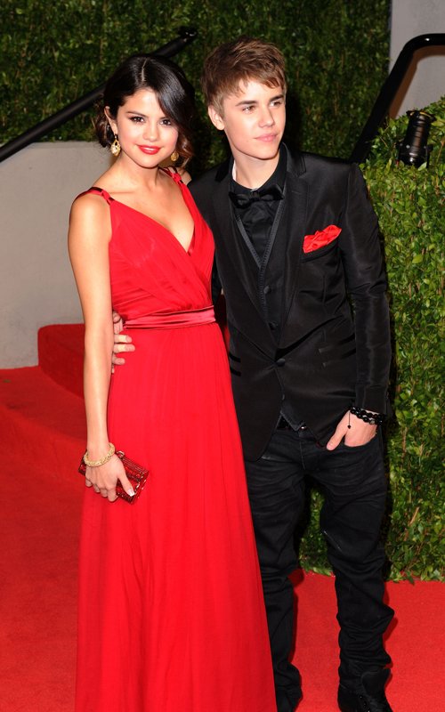 selena gomez red dress justin bieber. a red dress, while Justin