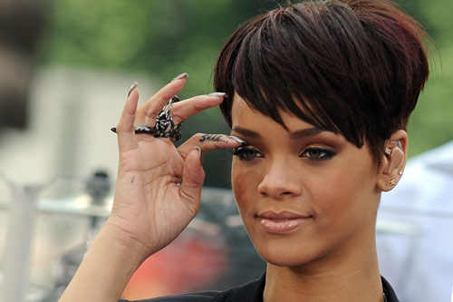 Finger Tattoo Ideas A Love tattoo on Rihanna's left middle finger