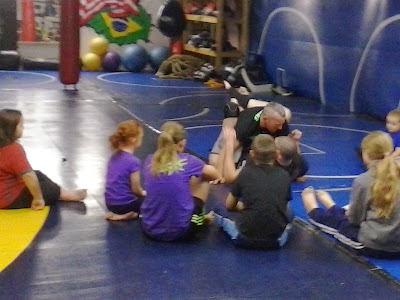 Brett Sbardella teaching kids how to get on top after being pushed down