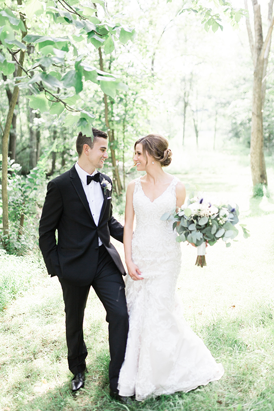 Bride and groom taking pictures in the woods for their Pittsburgh Wedding by Exhale Events 