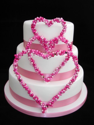 White Round Wedding Cakes Decorated with Heart Shape Small Pink Balls