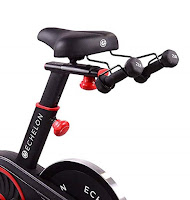 Echelon Smart Connect EX1 Spin Bike's comfort saddle with seat-mounted dumbbell holder, image