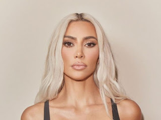 Kim Kardashian Channels Marilyn Monroe Again With Huge Hair and White Smaller than expected Dress Photo