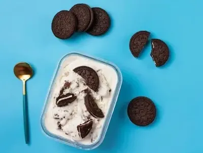 Delicious homemade Oreo cookies stacked neatly on a plate with creamy filling