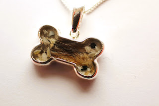 Sterling silver bone shaped pendant containing pet dog hair and ashes