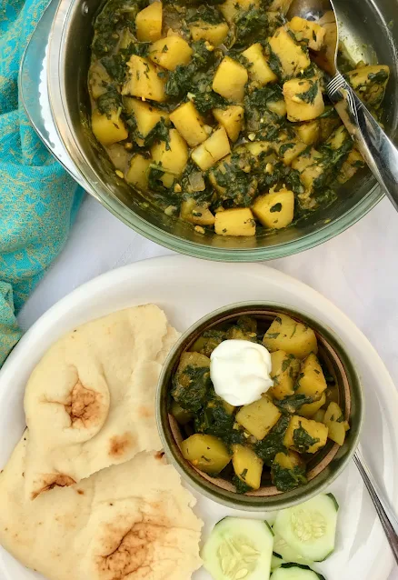 Serving potato and spinach curry.