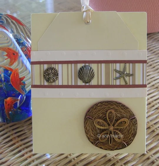 quilled sand dollar card with metal seashell charms