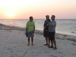 John, Eric and Capt. John on Camp Bay Beach (Note all the plastic bottles!)