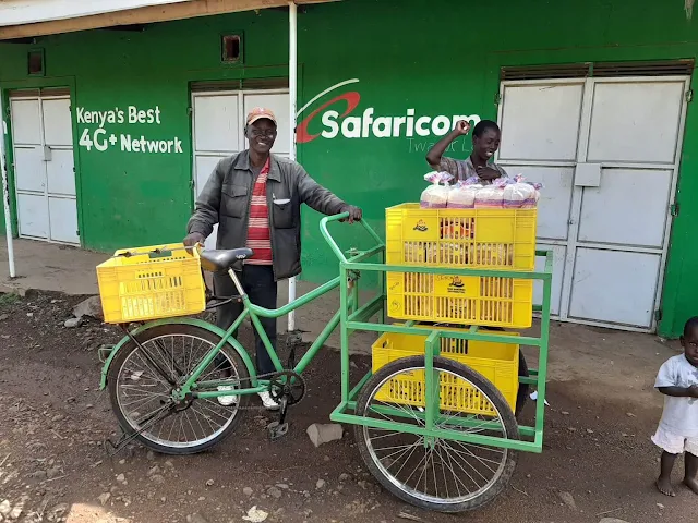 Kenyans with bicycle selling bread in Kenya.