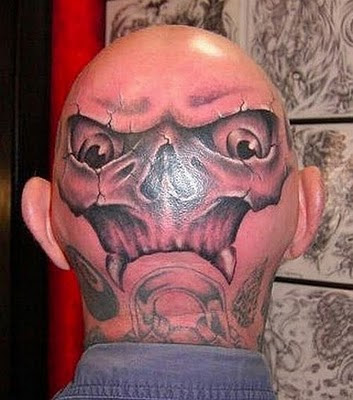 Alien head tattoo