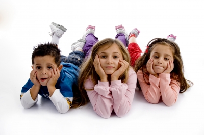 three children lying down NAMC montessori teacher student year end preparation