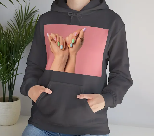 A Hoodie With Hands of Young Woman with Beautiful Manicure on Color Background