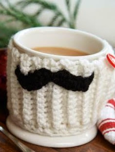 http://www.redheart.com/free-patterns/mustache-mug-hug