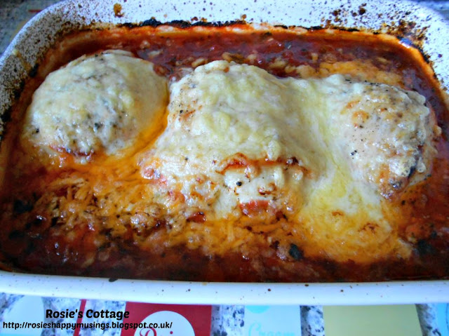 Cheese melts over the baked chicken fillets and combines with the tomato, garlic & onion sauce...