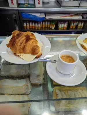Traditional coffee and croissant with cheese at Carrocel in Lisbon