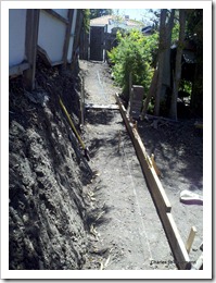 Excavate a cubic yard or more of clay hillside with a mallax and shovel