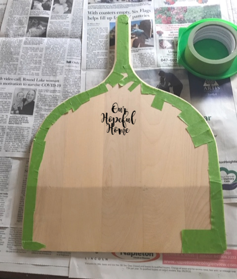 green painters tape pizza peel cutting board