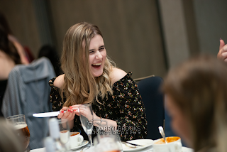 Natural fun shot of girl laughing at the Hull Hockey dinner event