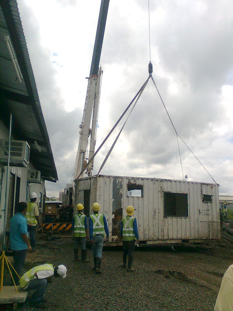 mobile crane lifting the container van