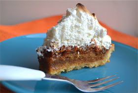 molten carrot cake in a pie shell topped with fluffy marshmallow meringue