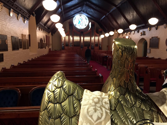 Glorious brass eagle overlooks St. Bart's interior