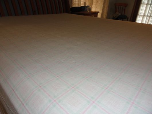 Making the bed with hospital corners