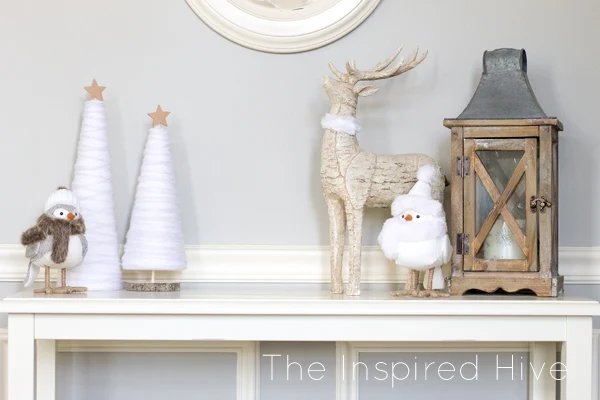 Make these easy and affordable DIY winter yarn trees to spruce up your winter decor! A great knock off idea to get the look for less!