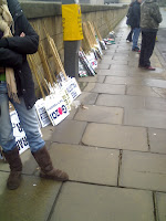 Many different banners were ready to be carried by willing hands People of all ages arrived to protest. © Stephen Glenn 2009