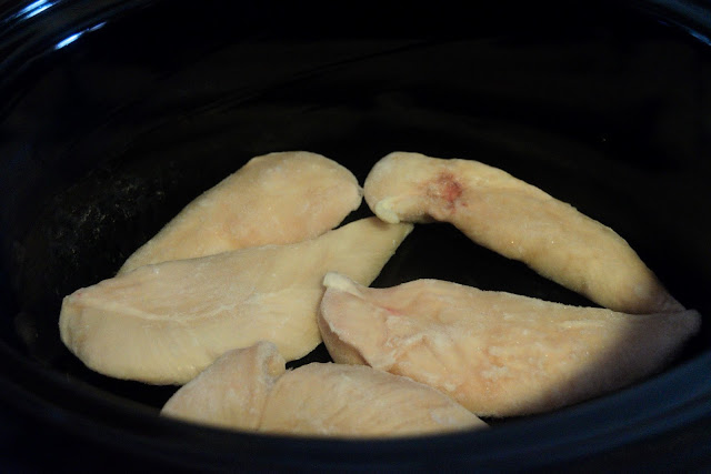 Frozen chicken tenderloins in the crock pot.